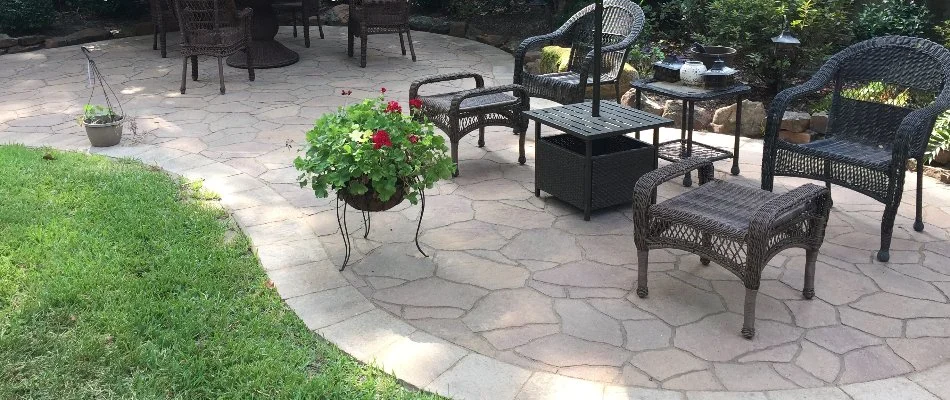 Outdoor furniture on natural stone patio in Kingwood, TX.