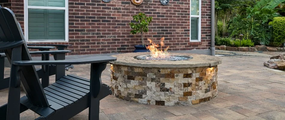 Gas fire pit with black chairs in Kingwood, TX.