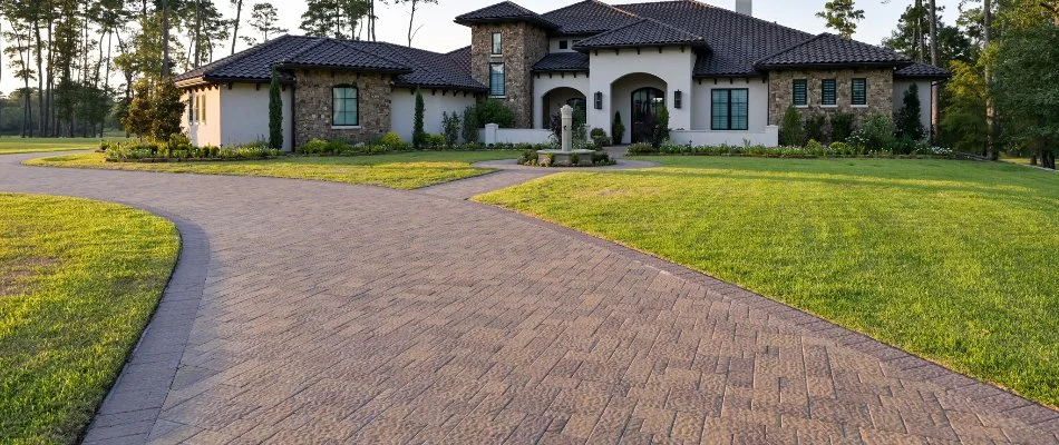 Large house with a paver driveway in Kingwood, TX.