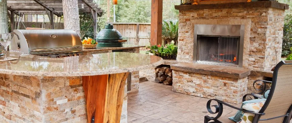 Outdoor kitchen and outdoor fireplace in Kingwood, TX.