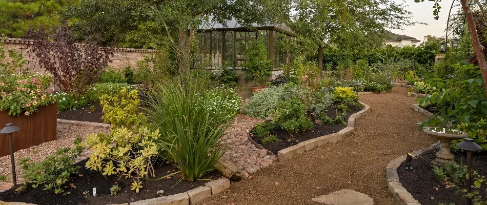 Atascocita, TX home with a running irrigation system.