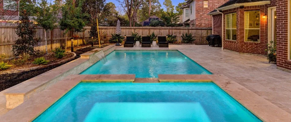 Plants and pool in a backyard in Conroe, TX.
